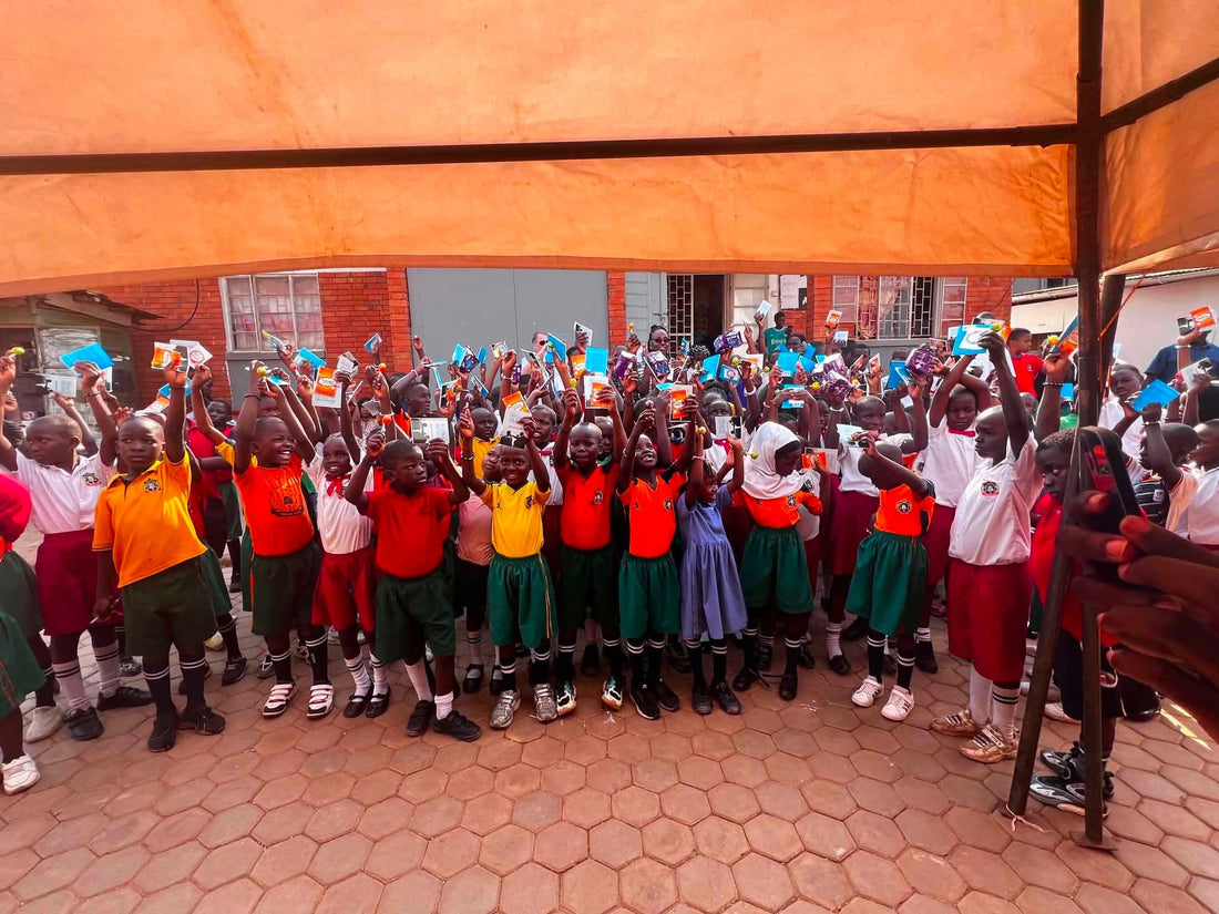 Children Kneel in Thanks as Blessing Books and Leaflets Are Shared in Uganda